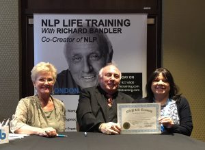 Lalla Hargreaves receiving qualification in NLP from Richard Bandler